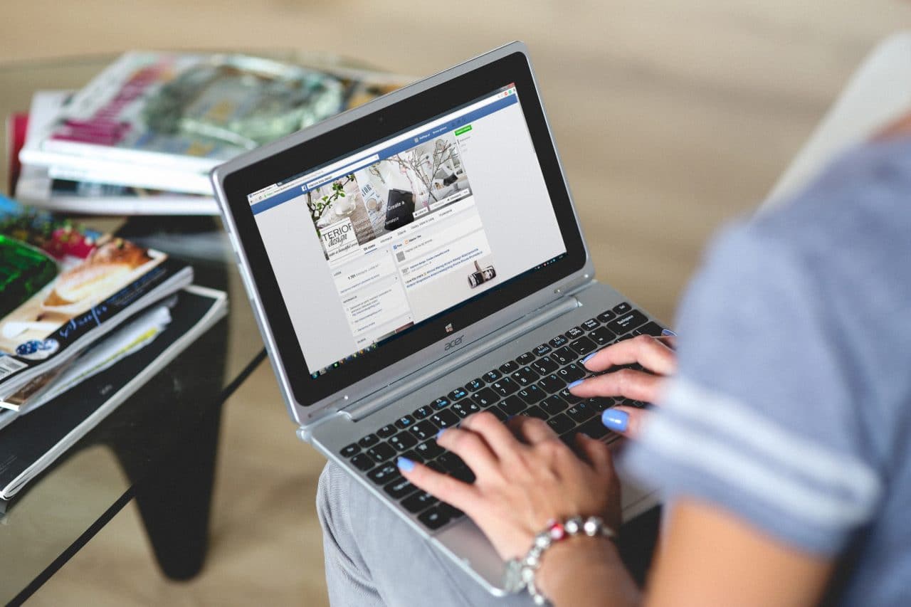 women typing on a laptop