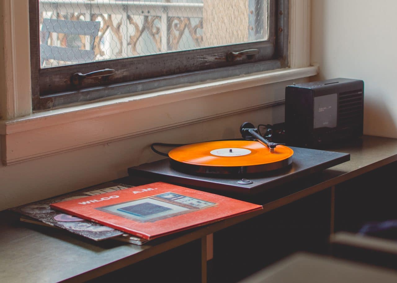 Vinyl record turntable by window
