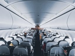 Airplane cabin full of passengers.