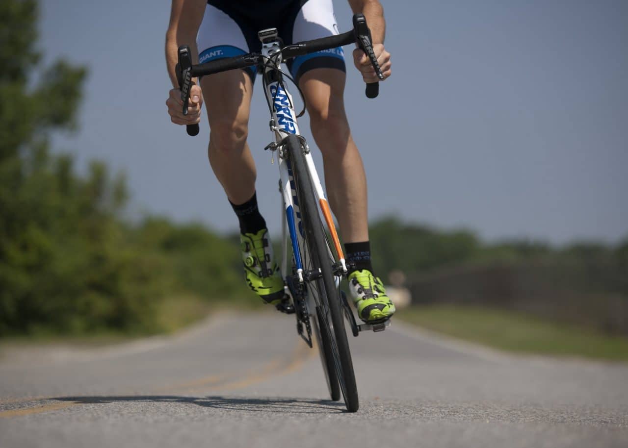 Man cycling on the open road.