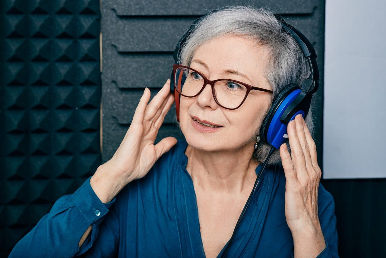 Older woman receiving a hearing test.