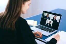 Woman attending a virtual work meeting on her laptop.