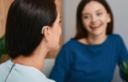 Woman with hearing aids has conversation